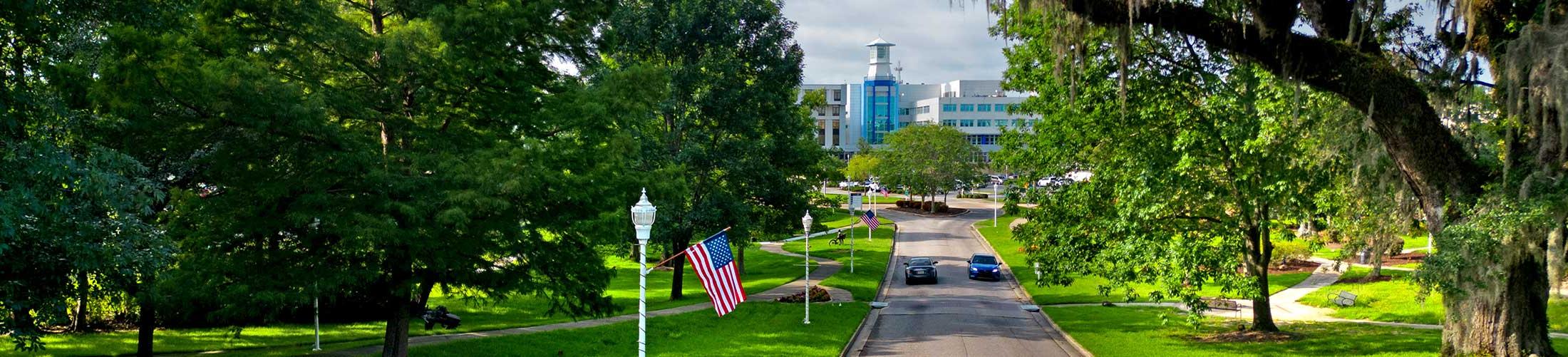 View of USA Medical with cars driving on the street in front of it.